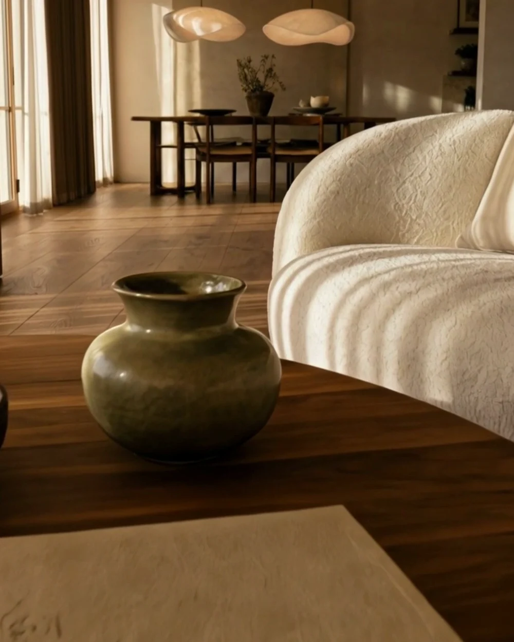 Close-up of oak grain, bouclé fabric and honed travertine